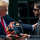 2017 NASCAR Cup winner Martin Truex Jr. presents Donald Trump with a helmet at an event honoring Truex’s win at the White House.